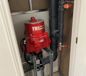 A modulating control valve with piping in a closet. 